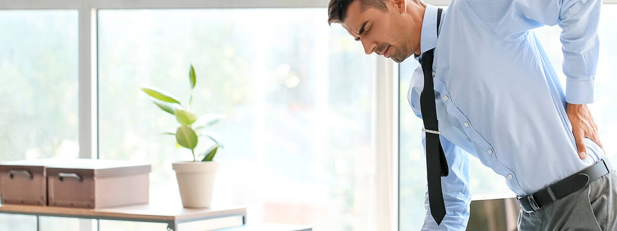Is Your Posture Short-Circuiting Your Nerves? Ergonomic and Chiropractic Tips