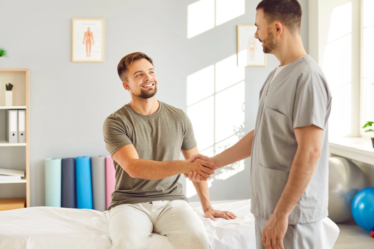 male-chiropractor-physical-therapist-shaking-hands
